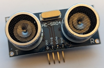 A picture of an HC-SR04 ultrasonic distance sensor.