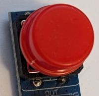Photo of a button with 3 connectors